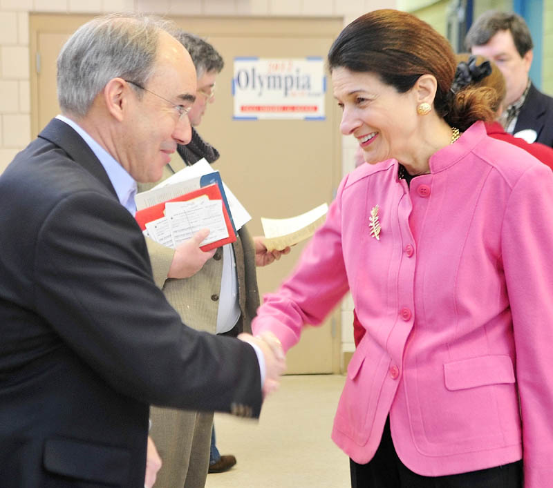 State treasurer Bruce Poliquin, left, and Sen. Olympia Snowe chat before the Kennebec County Super Caucus at Farrington School in Augusta on Saturday.