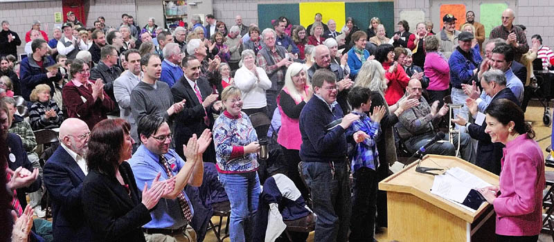Sen. Olympia Snowe gets a standing ovation as she speaks during the Kennebec County Super Caucus at Farrington School in Augusta on Saturday.