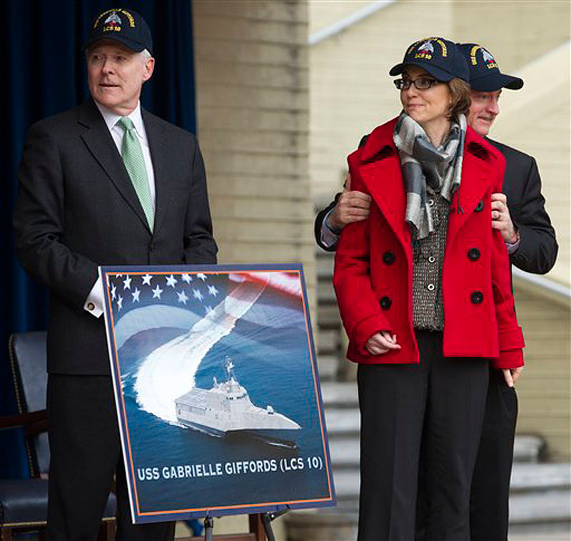 Navy Secretary Ray Mabus, former Arizona Rep. Gabrielle Giffords and her husband Mark Kelly, attend the unveiling of the USS Gabrielle Giffords at the Pentagon on Friday, Feb. 10. (AP Photo Manuel Balce Ceneta)