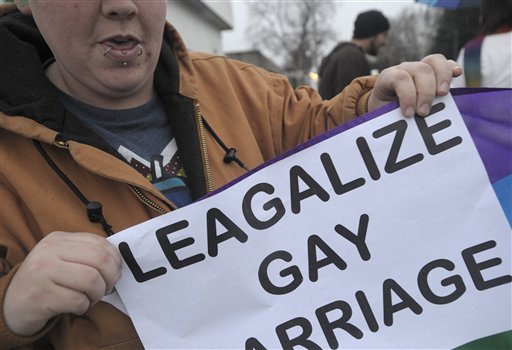 A woman holds up a sign in support of same-sex marriage in Marysville, Calif., after a federal appeals court declared California's same-sex marriage ban unconstitutional on Tuesday.