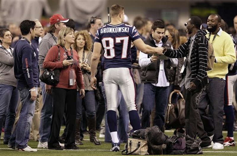 New England Patriots tight end Rob Gronkowski (87) greets people in Lucas Oil Stadium on Saturday, Feb. 4, 2012, in Indianapolis. (AP Photo/Mark Humphrey)