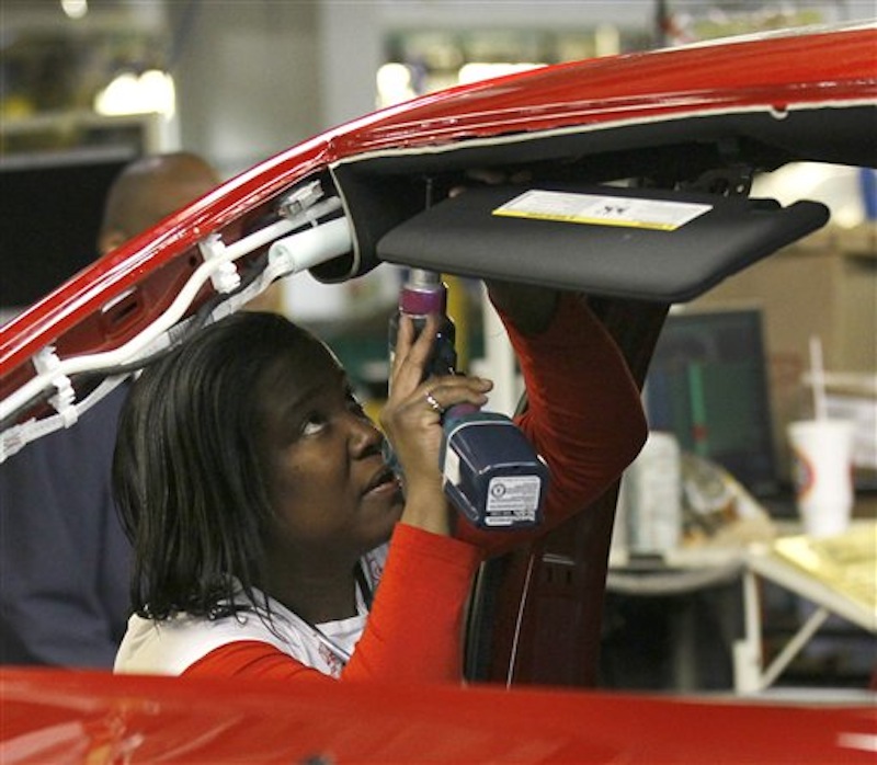 An auto worker assembles parts on the 2013 Dodge Dart at the Chrysler Plant in Belvidere, Ill. on Thursday, Feb. 2. The unemployment rate fell for the fifth straight month after a surge of January hiring by U.S. companies. (AP Photo/Charles Rex Arbogast)