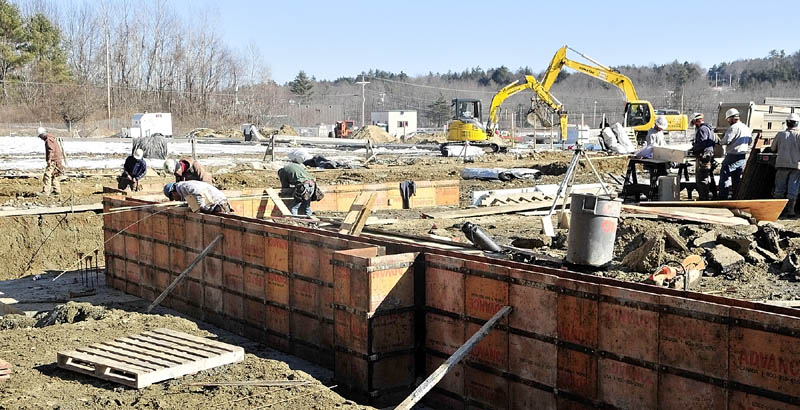 Workers build the foundation for the new Kennebec Ice Arena on Friday morning in Hallowell.