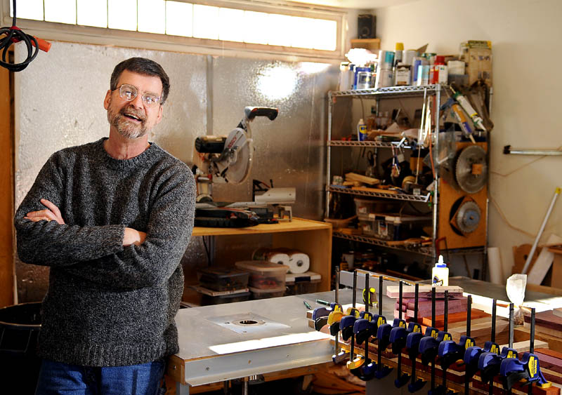 RATTLER: Dr. Kieran Kammerer builds wooden heirlooms, including bowls and baby rattles, at his Hallowell shop. The pediatrician’s handcrafted collectibles are sought across the world.