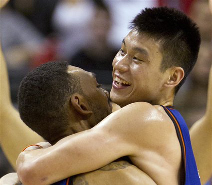 New York Knicks guard Jeremy Lin, right, celebrates with teammate Jared Jeffries after his game-winning 3-pointer in the final seconds of the game against the Toronto Raptors in Toronto on Tuesday The Knicks won 90-87.