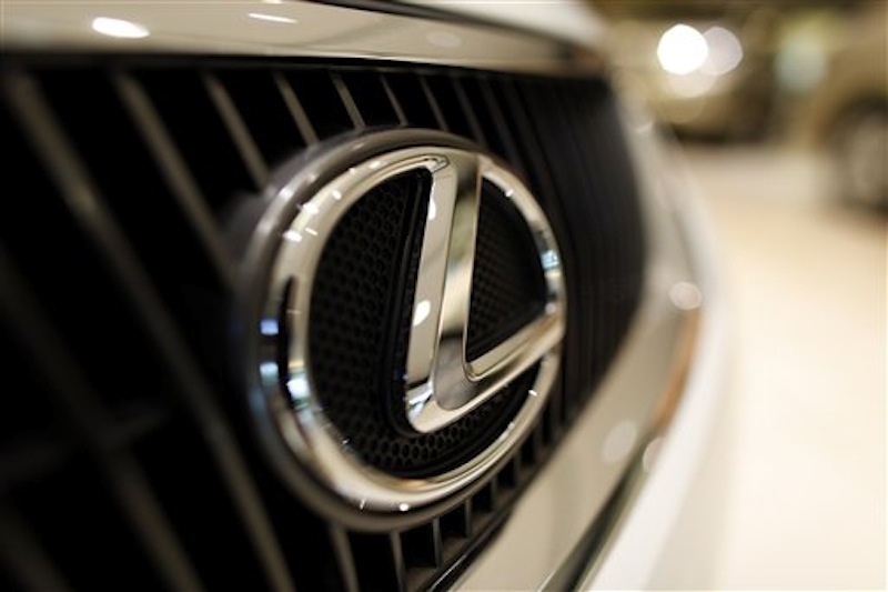 In this Aug. 2011 photo, the Lexus logo is displayed on a Lexus sedan in a Miami showroom. Lexus is the most dependable car, according to survey released Wednesday, Feb. 15, 2012. (AP Photo/Lynne Sladky, File)