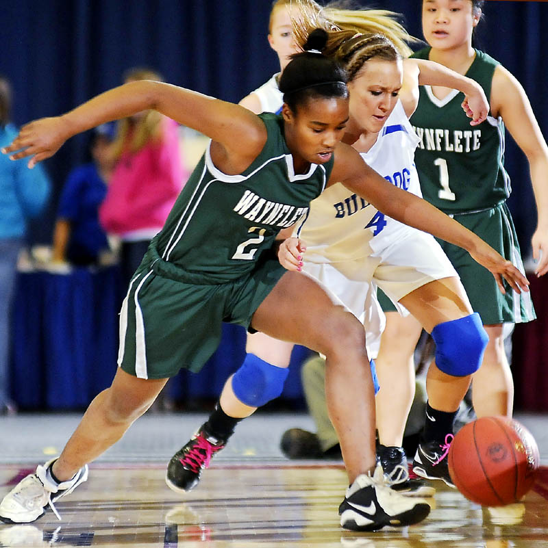 HEAD TO HEAD: Waynflete School's Rhiannan Jackson, left, and Madison Area Memorial High School's Melissa White charge for the ball Tuesday during a basketball match up in Augusta.