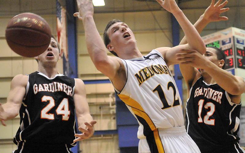 Photo by Michael G. Seamans in the second half of the Eastern Class B semi-finals at the Bangor Auditorium Wednesday. Gardiner defeated Medomak Valley 57-46.