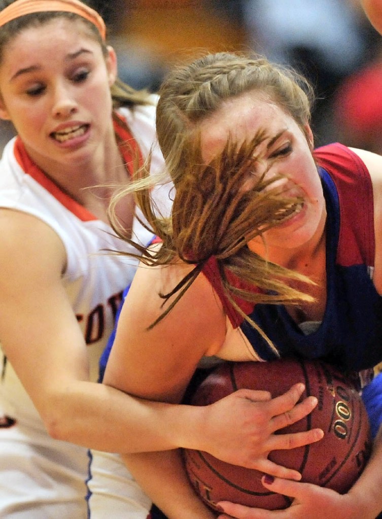 GIVE ME: Messalon-skee High School’s Kassi Michaud, right, battles for the ball with Skowhegan Area High School’s Natasha Thompson in the second quarter Friday night in Skowhegan.