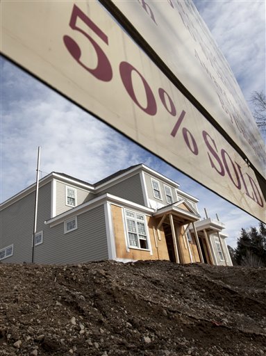 This Feb. 8, 2012, shows a home under construction at a planned community in Medfield, Mass.