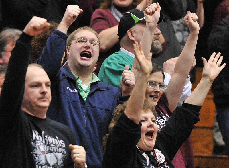 Photo by Michael G. Seamans Nokomis High School fans cheer a basket in the first half of the Eastern Class B quarterfinals game at the Bangor Auditorium Saturday. Nokomis defeated Medomak Valley 58-51.