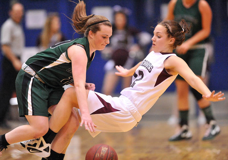 Photo by Michael G. Seamans Nokomis High School's Kylie Richards, 12, draws the offensive foul from Old Town High School's Ashley England in the first half of the Eastern Class B semi-finals at the Bangor Auditorium Wednesday.