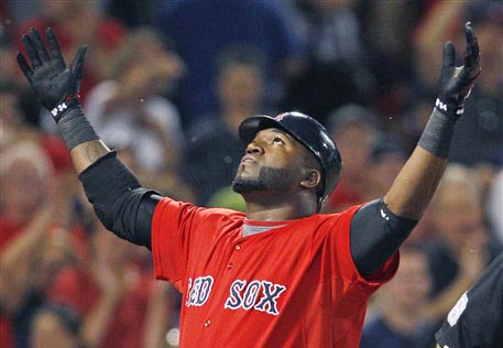 In this Aug. 26, 2011, photo, Boston Red Sox designated hitter David Ortiz reacts after crossing home plate following a home run against the Oakland Athletics at Fenway Park.