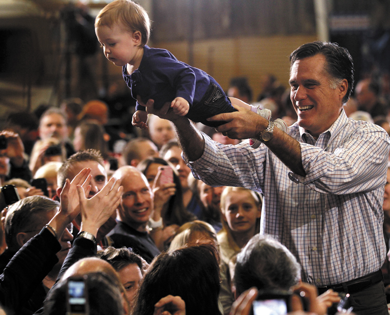 Republican presidential candidate, former Massachusetts Gov. Mitt Romney holds One-year-old Madison Busch during a campaign rally in Loveland, Colo., Tuesday, Feb. 7, 2012. (AP Photo/Gerald Herbert)