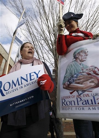A supporter of Republican presidential candidate, Rep. Ron Paul, right, argues with a supporter of Republican presidential candidate Mitt Romney (AP Photo/Charles Dharapak).