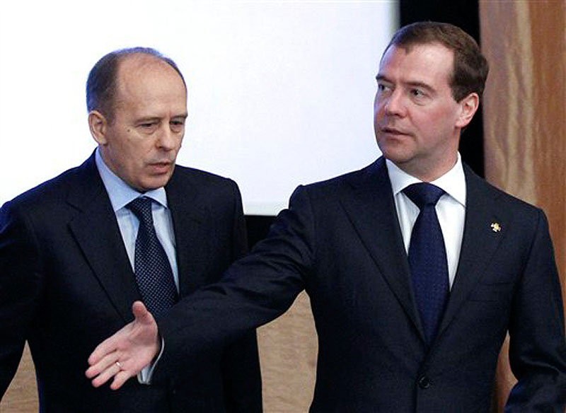 In this Tuesday, Feb. 7 photo, Russian President Dmitry Medvedev, right, and Federal Security Service Chief Alexander Bortnikov attend a meeting with top officials of the Federal Security Service (FSB) in Moscow. The FSB said Friday that Russian military officer Lt.-Col. Vladimir Nesterets pleaded guilty to charges of passing classified data to the CIA for money, and was sentenced to 13-years in prison. (AP Photo/RIA -Novosti, Dmitry Astakhov, Presidential Press Service)