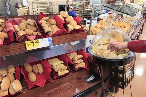 A customer samples some fresh baked bread at a grocery store in Cincinnati today. Nearly all Americans consume much more sodium than they should, according to a report from the Centers for Disease Control and Prevention. Some foods that are consumed several times a day, such as bread, add up to a lot of sodium even though each serving is not high in sodium.