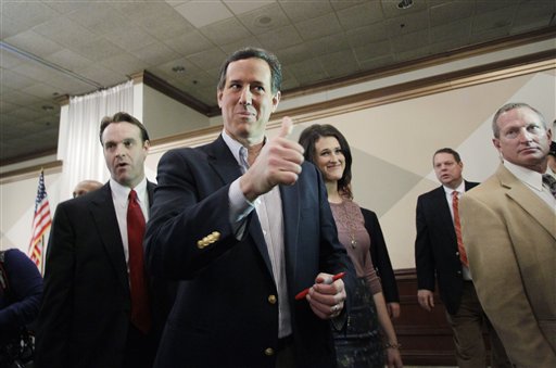 Republican presidential candidate Rick Santorum gives a thumbs up to a supporter at the Livonia Chamber of Commerce breakfast today in Livonia, Mich.