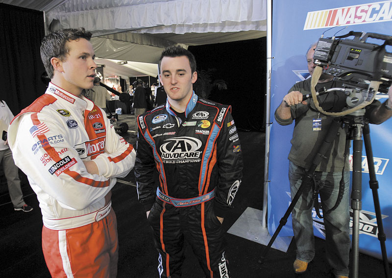 STILL ON THE OUTS: Despite winning last year’s Daytona 500, Trevor Bayne, left, still does not have a full-time Sprint Cup or Nationwide Series ride. Bayne is shown talking to fellow driver Austin Dillon during media day Thursday at Daytona International Speedway in Daytona Beach, Fla.