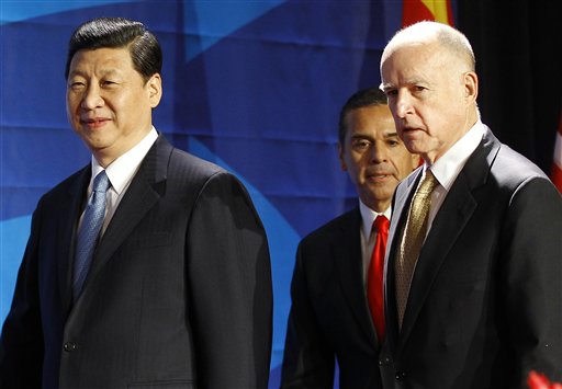 Chinese Vice President Xi Jinping, left, leaves the stage with Los Angeles Mayor Antonio Villaraigosa, center, and California Gov. Jerry Brown after speaking at the US-China Economy and Trade Cooperation Forum today in Los Angeles. Xi Jinping was the featured speaker at the forum.