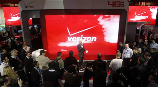 Attendees check out the unveiling of 4G devices at the Verizon booth during the Consumer Electronics Show recently. Challenging Netflix, Verizon says it will start a video streaming service later this year.