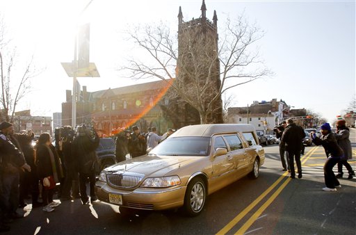 The hearse carrying the body of Whitney Houston leaves Whigham Funeral Home in Newark, N.J. for a short ride to the New Hope Baptist Church for her funeral Saturday, Feb. 18, 2012. (AP Photo/Rich Schultz)