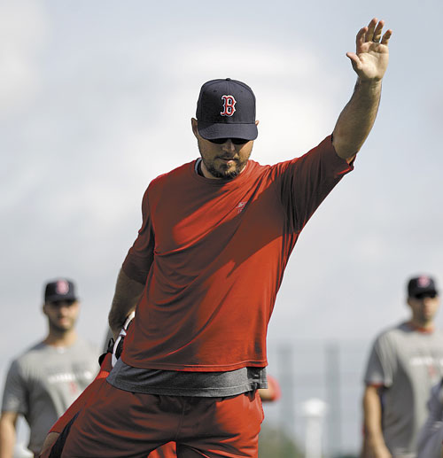 GETTING READY: Boston Red Sox pitcher Josh Beckett works out as pitchers and catchers officially report to spring training Sunday in Fort Myers, Fla.