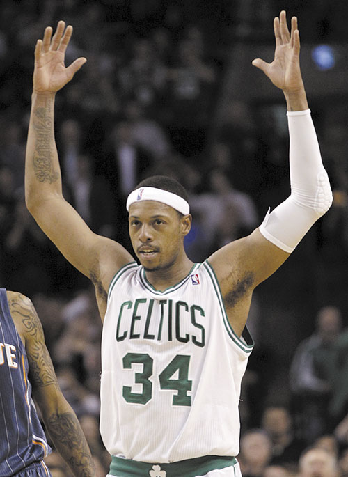 MOVING UP: Boston forward Paul Pierce acknowledges the crowd after passing Larry Bird for the No. 2 spot on the team’s career scoring list, during the second half against the Charlotte Bobcats on Tuesday in Boston.