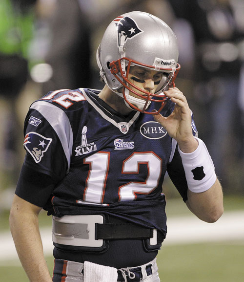 TOUGH NIGHT: New England Patriots quarterback Tom Brady reacts toward the end of Super Bowl XLVI against the New York Giants on Sunday night in Indianapolis. Brady finished the game 27 of 41 for 276 yards, two touchdowns and an interception.