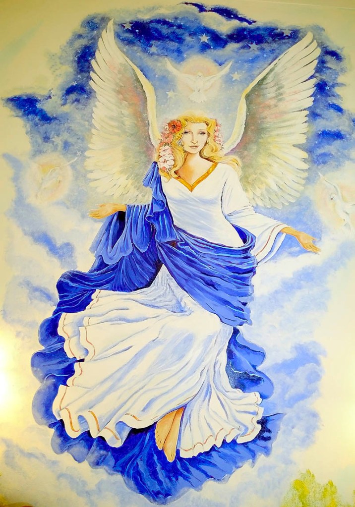 This large angel painted by Lois Tomacelli is on the wall at the Augusta Spiritualist Church on Perham Street in Augusta.