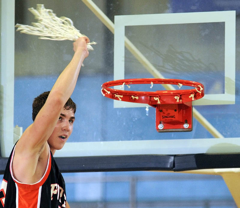 GIVE IT A TWIRL: Forest Hills junior Evan Worster swings the net as the Tigers celebrate a 61-60 victory against Hyde to win the Western D championship Saturday at the Augusta Civic Center. Worster scored a game-high 33 points.
