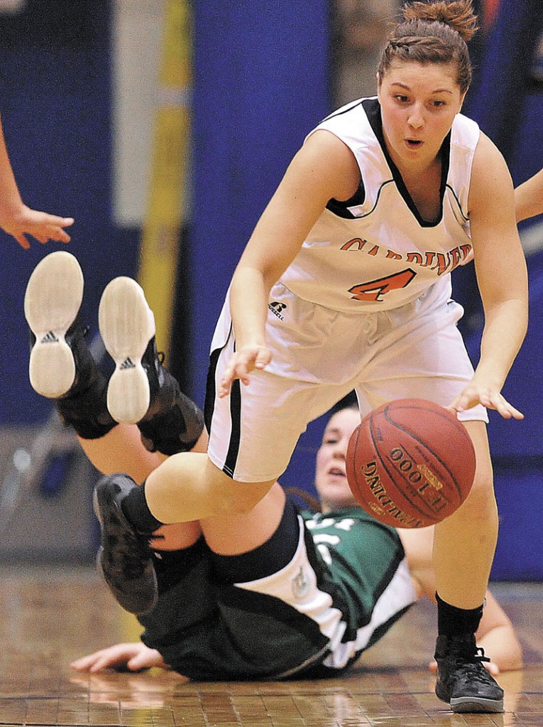 Gardiner High School's Kylee Granholm, 4, recovers the ball after stealing it from Mount Desert Island High School's Hannah Shaw, 25, back, in the first half of the Eastern Class B quarterfinals game at the Bangor Auditorium Saturday. Gardiner defeated MDI 63-38.
