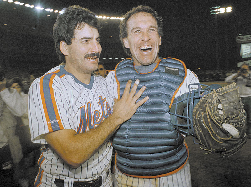 GOING TO BE MISSED: New York Mets’ Keith Hernandez, left, and Gary Carter are happy-looking ballplayers as they come off the field at Shea Stadium in New York after clinching the National League East title in 1988. Carter has died Thursday at age 57.