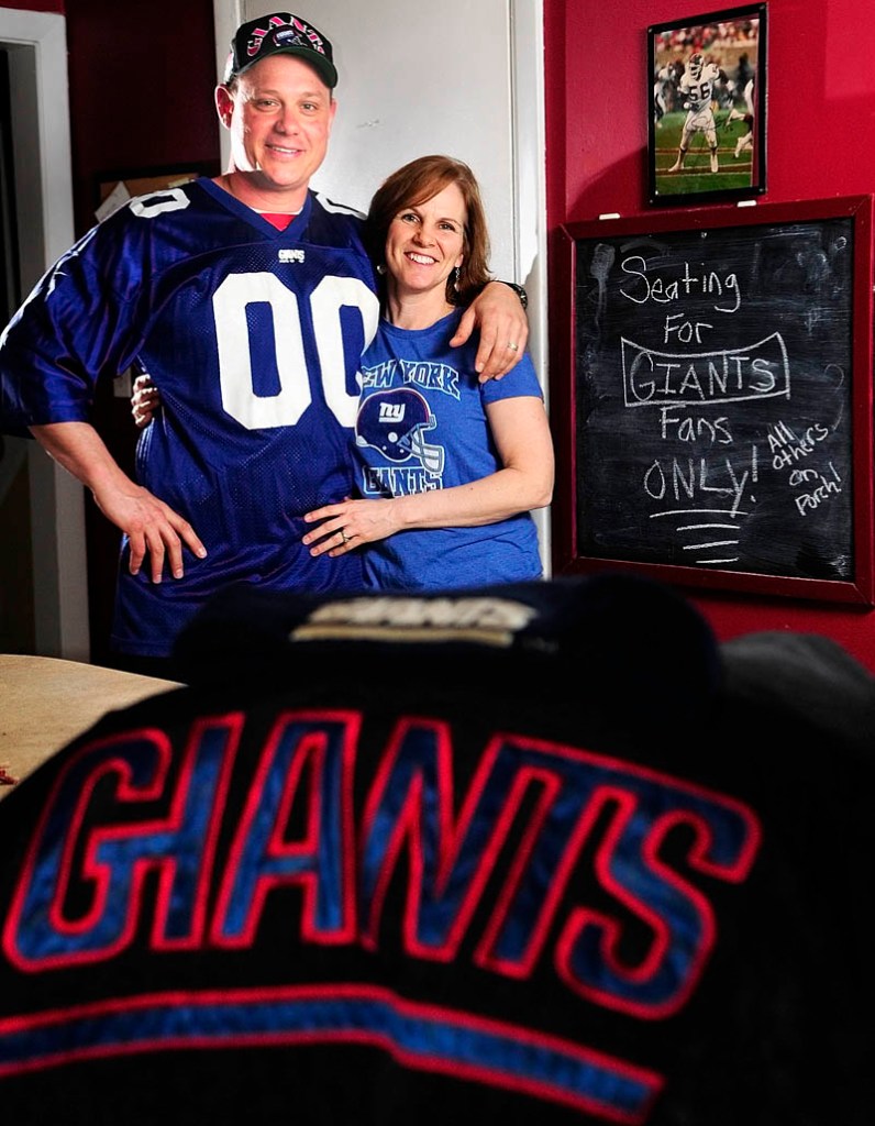 GIANTS FANS IN PATS COUNTRY: Joel and Holly Stoneton of Winthrop will be rooting for the New York Giants in Super Bowl XLVI.