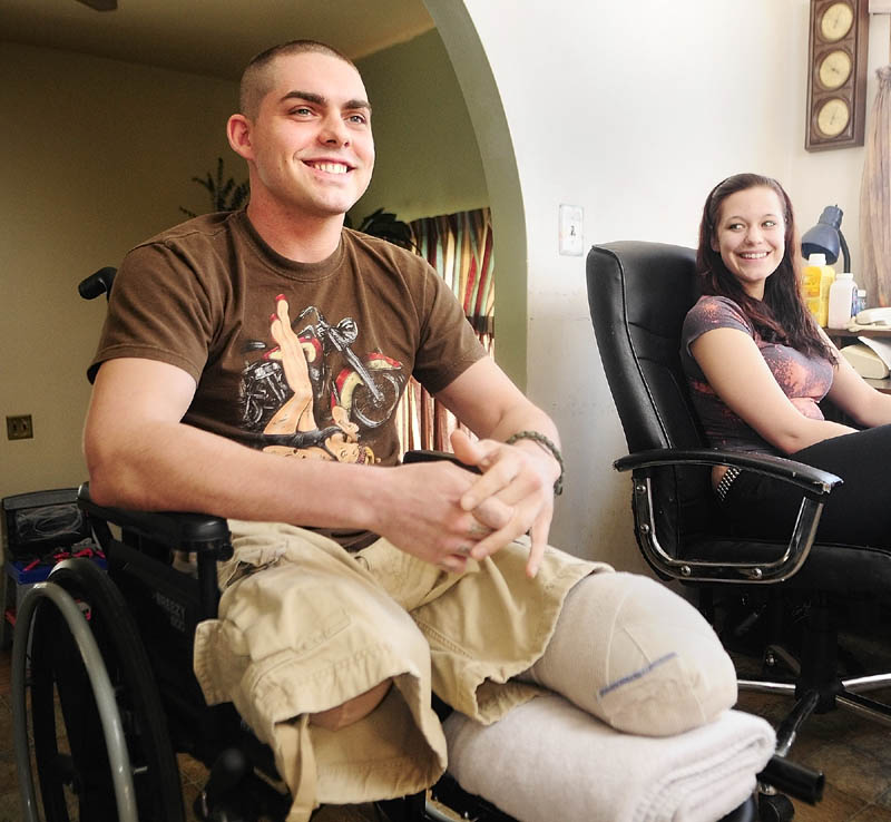 Jeremy Gilley, left, and girlfriend Rachael Turcotte answer an interviewer’s questions at his parent’s home in Palermo. Gilley came back from Iraq, only to be pinned between vehicles in a crash.