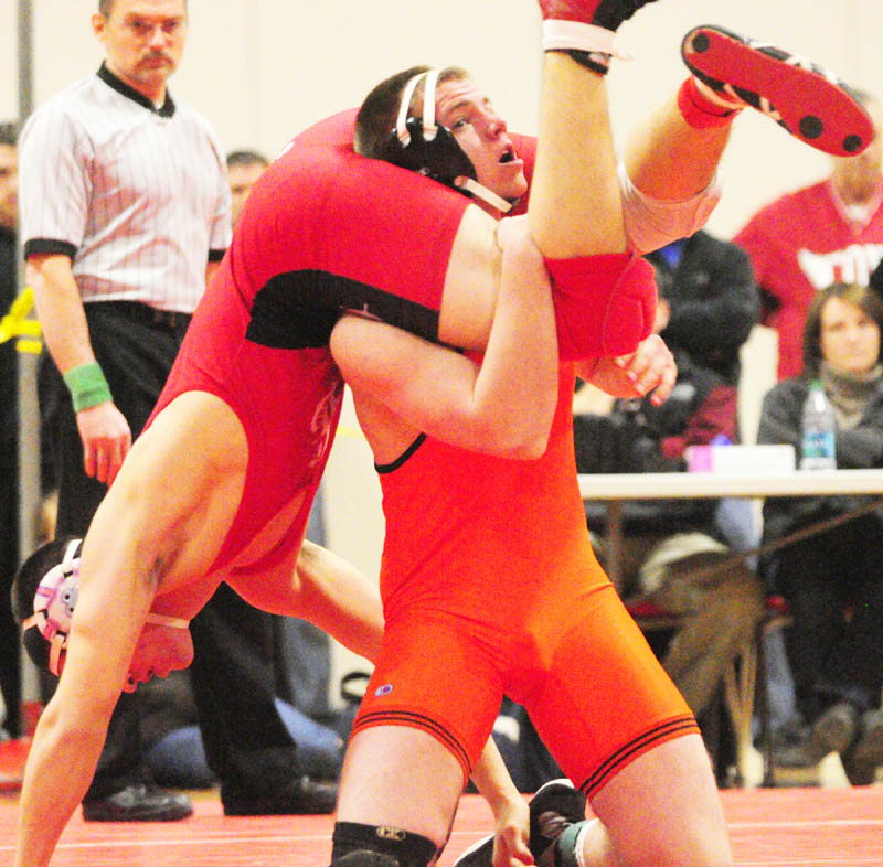 HANG ON: Camden Hills’ Anthony Batty, left, and Skowhegan’s Levi Hayden compete in the 182-pound finals match during the Kennebec Valley Athletic Conference meet Saturday at Cony High School in Augusta. Batty pinned Hayden to win the match.