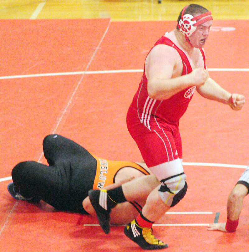 TITLE-WINNING MATCH: Cony’s Steven Morse jumps up and celebrates after pinning Winslow’s Aaron Lint during the 285-pound finals match at the Kennebec Valley Athletic Conference meet Saturday at Cony High School in Augusta. The pin put the Rams over to top to win the Class A title by one point.