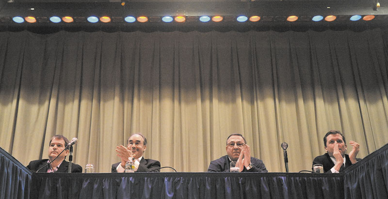 From left, David Bernhardt, Sec. of Transportation, Bruce Poliquin, State Treasurer, Gov. Paul LePage, and Stephen Bowen, education commissioner, listen to questions during a town hall meeting at Madison Junior High School Thursday night.