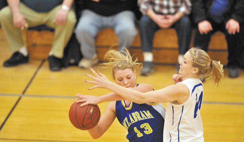 PRESSURE DEFENSE: Madison’s Cristie Vicneire, right, defends Mt. Abram’s Mikayla Luce in the second quarter Tuesday at Madison Area Memorial High School.