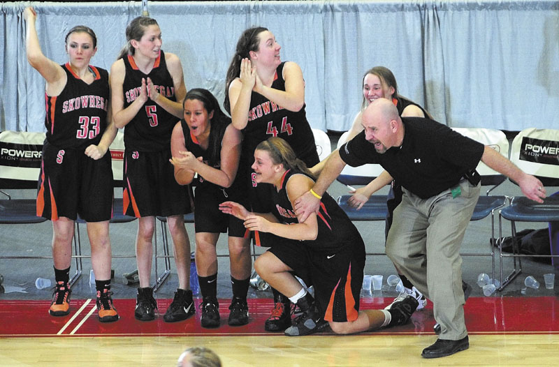 ALL RIGHT: Players on the Skowhegan bench and head coach Heath Cowan celebrate as the Indians beat Mt. Blue in on the first night of the Eastern Maine Class A tournament Friday at the Augusta Civic Center. richmond buckfield standish softball