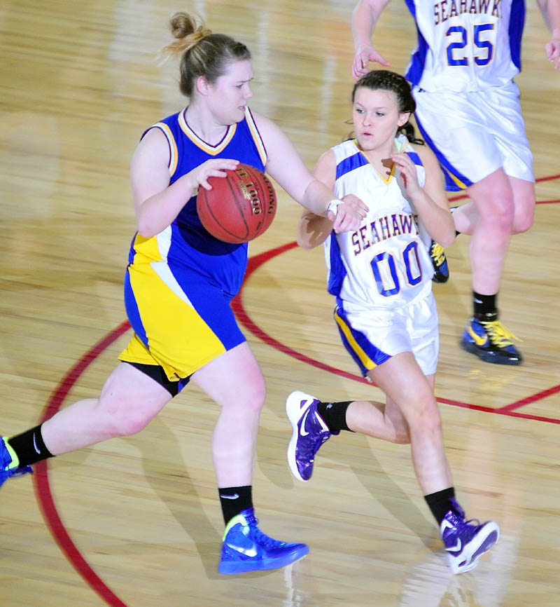 Mt. Abrams' Tori Beane tries to get past Boothbay Region's Abby McLellan during the Class D West tournament on Tuesday afternoon at the Augusta Civic Center.