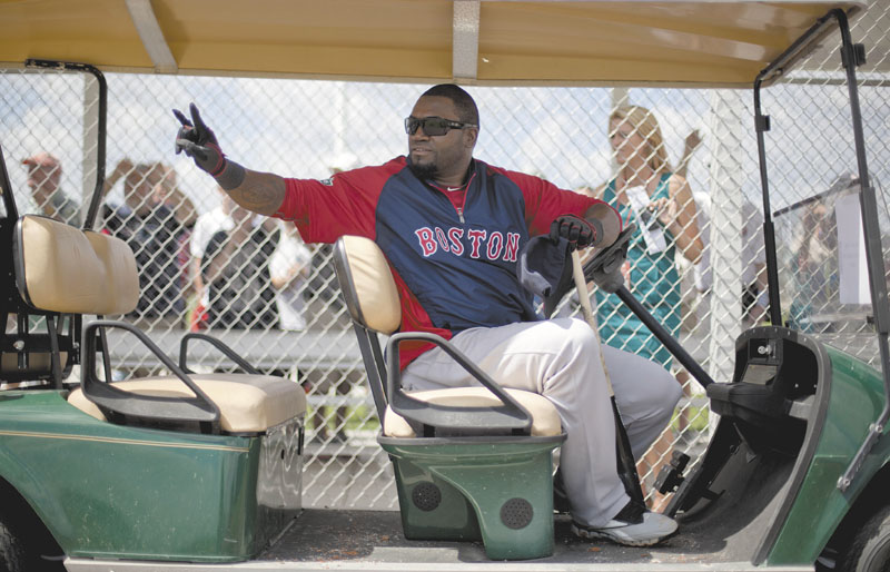 RIDING IN STYLE: Boston designated hitter David Ortiz takes a ride in a golf cart during spring training Tuesday in Fort Myers, Fla. Ortiz said it was an honor to be a teammate of catcher Jason Varitek, who will announce his retirement Thursday.