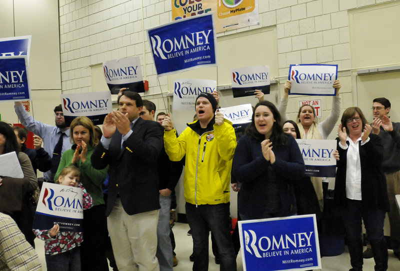 Supporters of Mitt Romney cheer Saturday as their candidate is introduced during the Portland Republican City Committee Caucus at Riverton Elementary School in Portland.