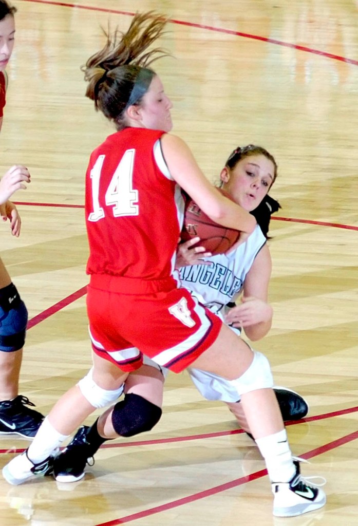 ALL HUSTLE: Rangeley’s Tori Letarte, right, and Vinalhaven’s Eliza Drury go for a loose ball during a Western Maine Class D semifinal Thursday morning at the Augusta Civic Center. Letarte, a 5-foot-6 sophomore, scored a game-high 12 points to help the Lakers advance with a 54-46 victory.