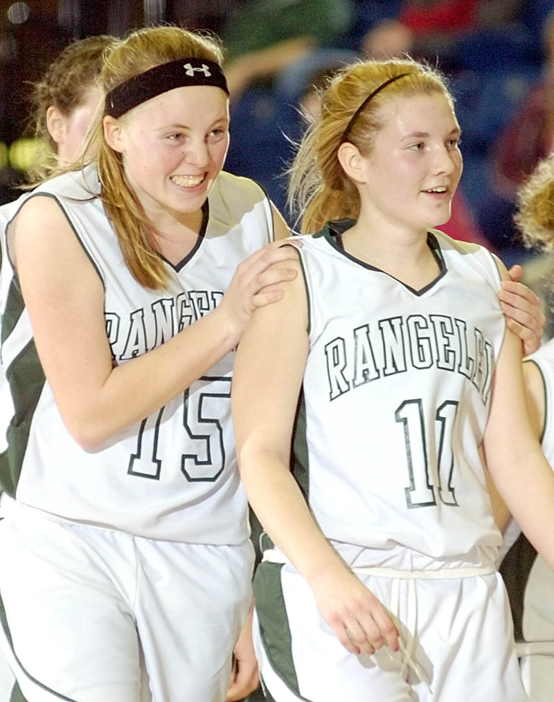 JOB WELL DONE: Rangeley's Taylor Esty, left, celebrates with teammate Seve Deery-Deraps after the Lakers beat Vinalhaven during the Western Maine Class D tournament on Thursday morning at the Augusta Civic Center.