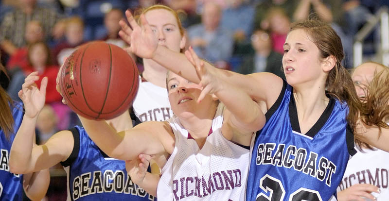 GET BACK HERE: Richmond’s Lindsy Hoopingarner, left, and Seacoast Christian’s Kylene DeSmith battle for a rebound during the Western Maine Class D semifinals Thursday morning at the Augusta Civic Center.