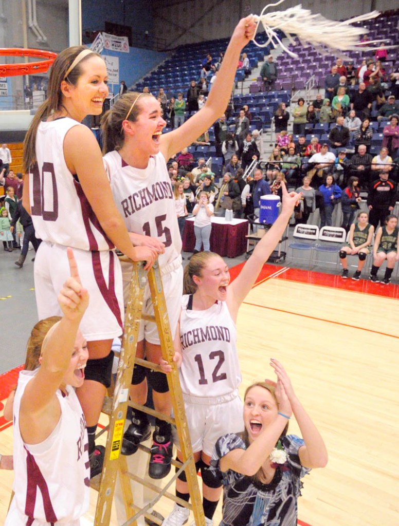 SWING THE NET: Richmond’s Alyssa Pearson, left, Danica Hurley, Jamie Plummer and Brianna Snedeker and manager Kayla Hurley celebrate after beating Rangeley to win the Western Maine Class D championship Saturday afternoon at the Augusta Civic Center.