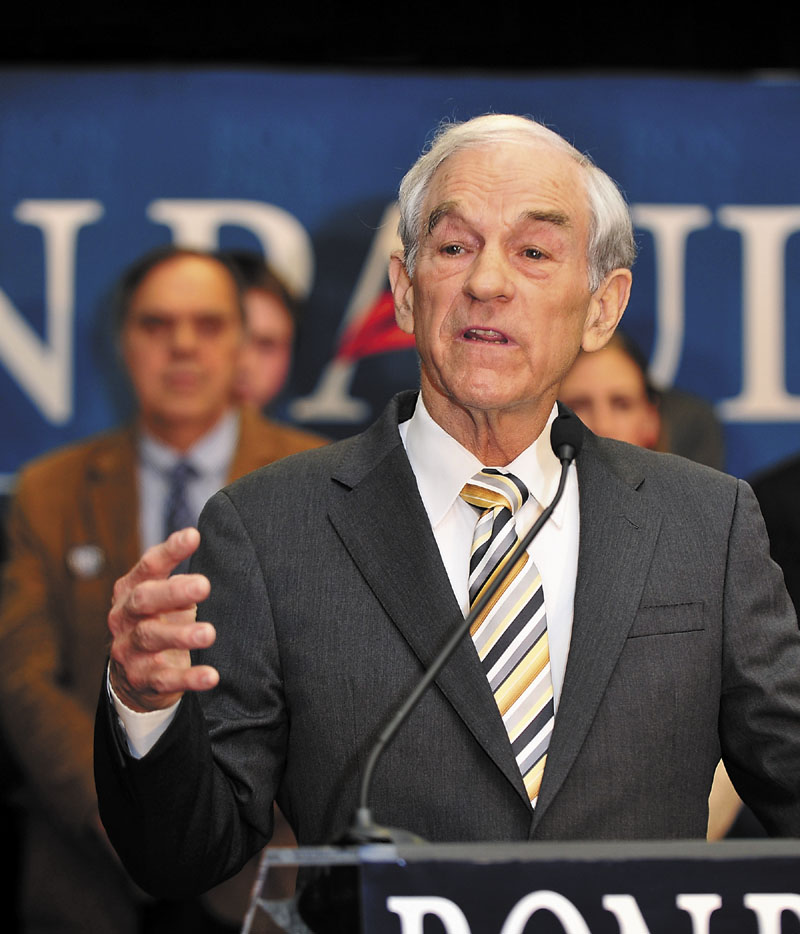 RUNNER-UP: U.S. Rep. Ron Paul, R-Texas, talks to supporters Saturday at the Seasons Event and Conference Center in Portland. Paul finished behind Mitt Romney.
