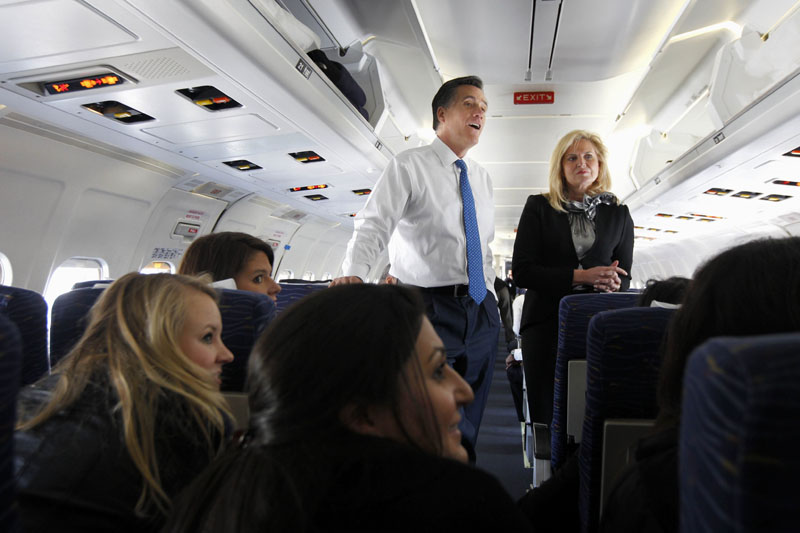 AIR ROMNEY: Republican presidential candidate Mitt Romney and his wife Ann talk to reporters Tuesday on his campaign plane in Columbus, Ohio, before taking off for Boston.