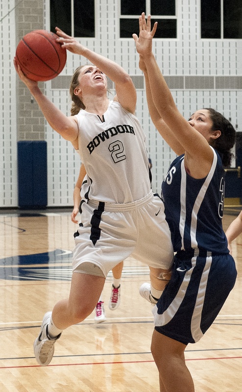 Kaitlin Donahoe goes up for a basket during Bowdoin’s NCAA tournament game Friday night against George Fox. Donahoe scored 18 points, but the Polar Bears lost, 71-55.